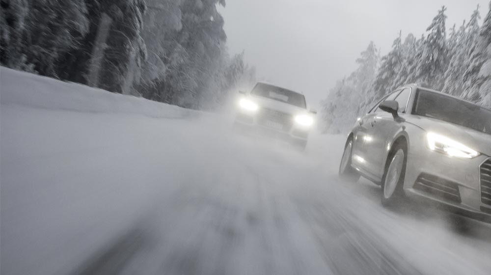 Cars driving in winter on snow